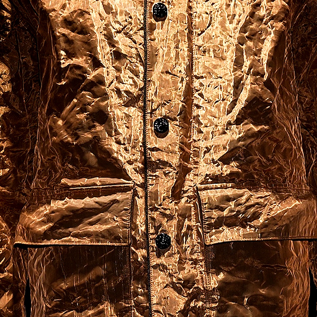 Crinkled copper surface of the Stone Island Pure Metal Shell jacket
